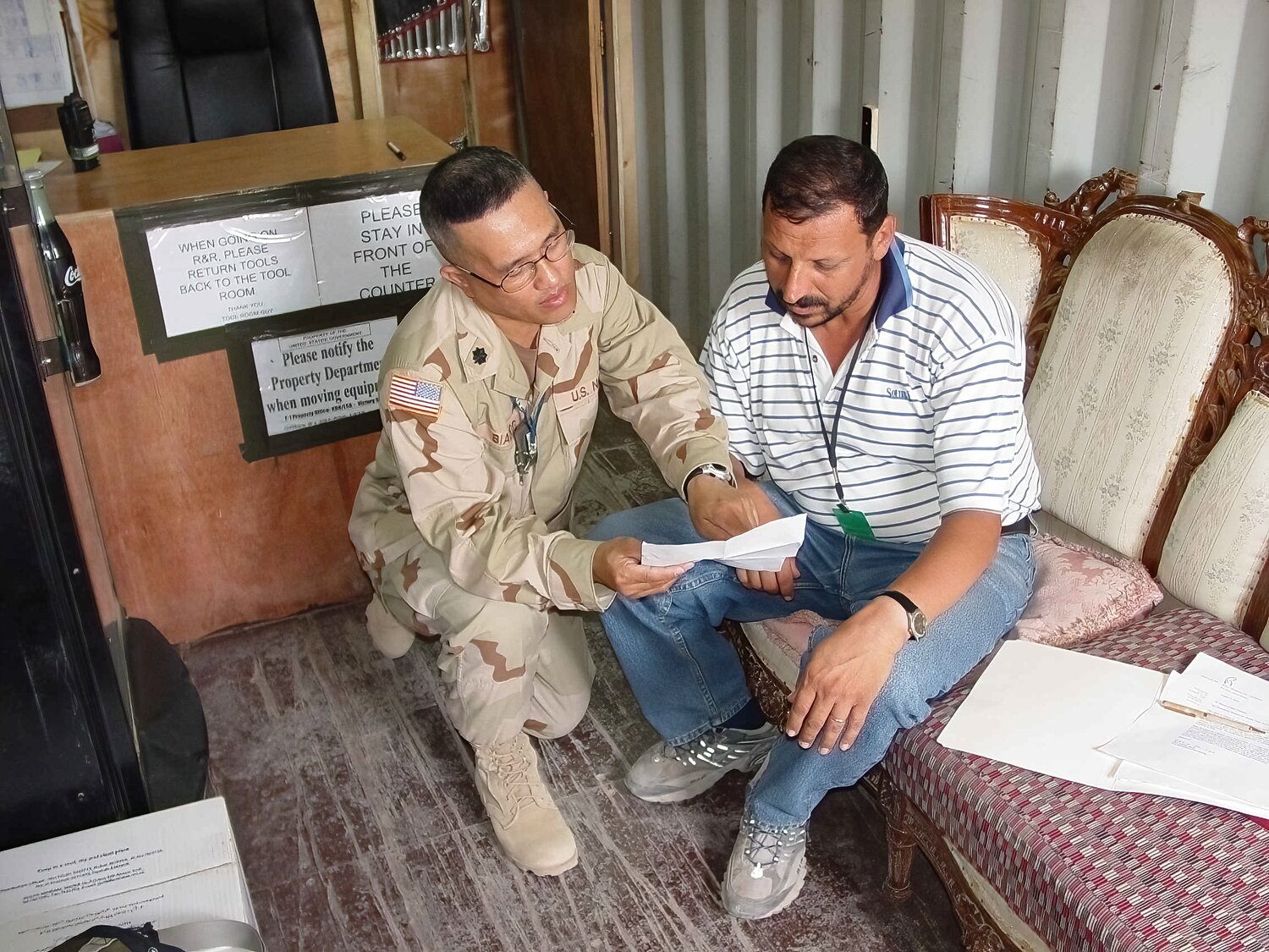 Saying prayer, encouraging words, and offering support to Thair Behnan, August 17, 2004, at Camp Liberty, Baghdad, Iraq.